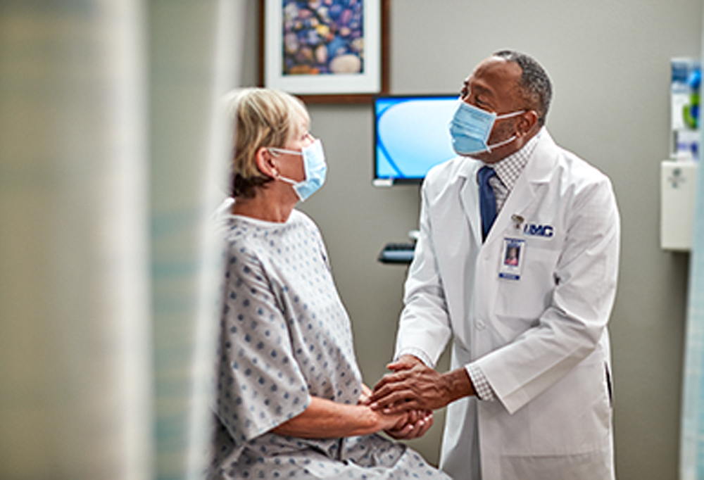 UMC Transplant physician with patient