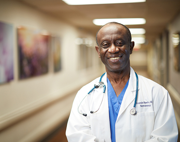 Doctor smiling in UMC hallway